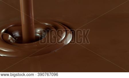 Detail of pouring hot chcocolate. Studio macro shot.