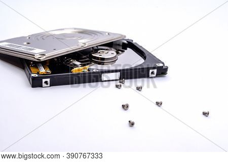 Internal Parts Of A Hard Disk Isolated On A White Background. Close Up Of Hard Disk Drive Inside Vie