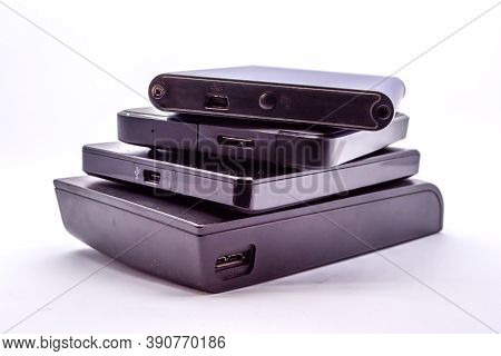 Hdd - Stack Of Portable Hard Disk Drives Isolated On White Background. Pile Of External Hard Disk Dr
