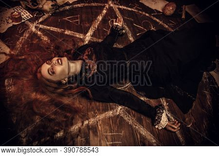 A portrait of a scary witch in the wooden house. Magic, dark force, spell. 