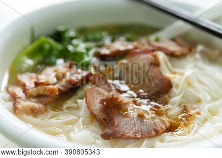 Side View Bowl Of Bbq Prok With Rice Noodles