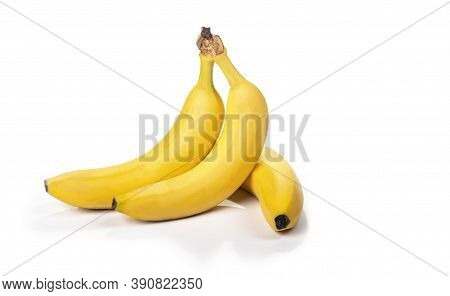 Shooting In The Studio. A Branch Of Ripe Yellow Bananas In A Peel. On White Background. Close-up