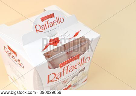 Raffaello Candies On Beige Background. Raffaello Is A Spherical Coconut Almond Confection That Itali