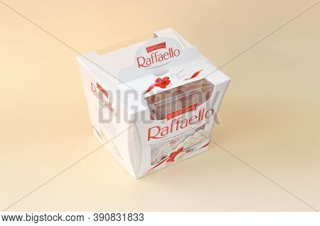 Raffaello Candies On Beige Background. Raffaello Is A Spherical Coconut Almond Confection That Itali