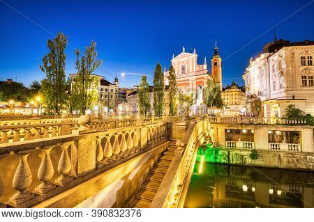 Ljubljana City Center At Dusk Overlooking The Triple Bridge And Beautiful Franciscan Church, Sloveni
