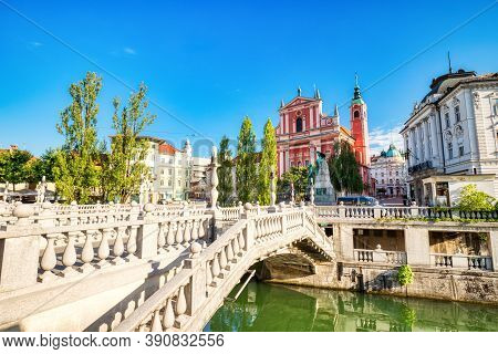 Ljubljana City Center During A Sunny Day Overlooking The Triple Bridge And Beautiful Franciscan Chur