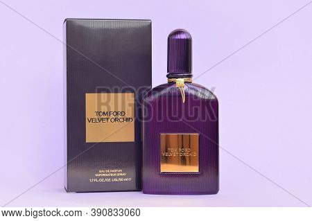 Tom Ford Velvet Orchid Fragrance Perfume Bottle Lies On Light Lilac Background. Tom Ford Is American