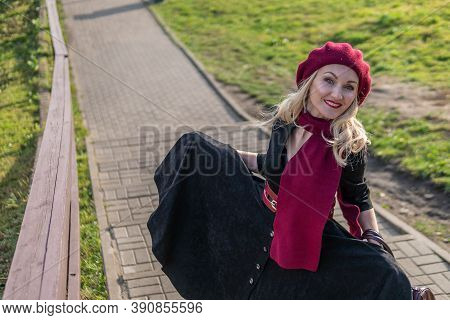 A Beautiful Girl Walks Up The Stairs, Both In Burgundy Palette And Biret, An Adult With Gentle Lips 