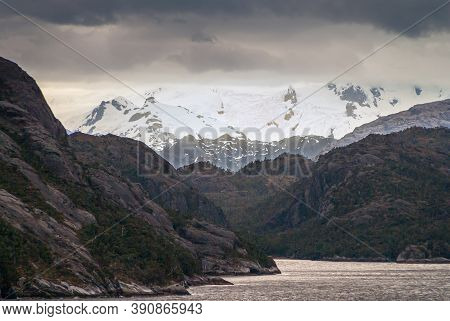 Sarmiento Channel, Chile - December 11, 2008: Amalia Glacier And Fjord. Blinding White Snow On Mount