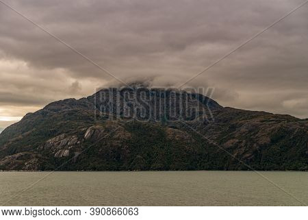 Sarmiento Channel, Chile - December 11, 2008: Amalia Glacier And Fjord. Gray Cloudscape Descends And