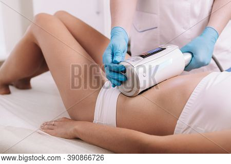 Cropped Shot Of A Woman Getting Endospheres Therapy At Beauty Clinic. Cosmetologist Using Endosphere
