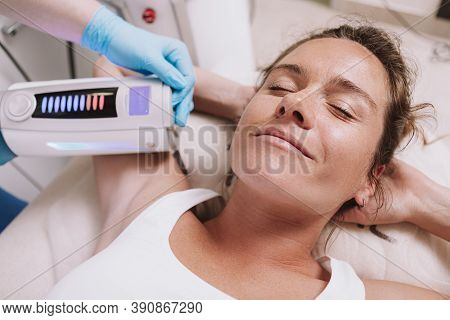 Cropped Close Up Of A Happy Mature Woman Enjoying Skin Tightening Slimming Procedures At Spa. Beauti