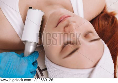 Top View Cropped Shot Of A Woman Relaxing At Cosmetology Salon, Getting Facial Endospheres Treatment