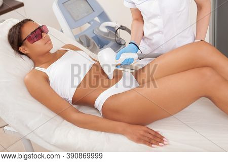 Attractive African Woman With Sporty Fit Body Getting Painless Laser Hair Removal Treatment At Beaut