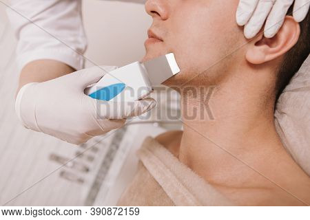Cropped Shot Of A Man Getting Facial Cleanse By Professional Cosmetologist