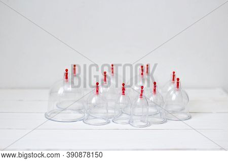 Jars For Hijama On A White Wooden Background. Bloodletting. Sunnah Treatment. Islam.