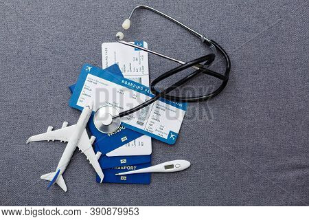 Coronavirus And Travel Concept. The Concept Of Restrictions For Tourism. Passport, Thermomether And 