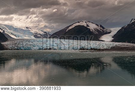 Sarmiento Channel, Chile - December 11, 2008: Amalia Glacier Melting End Reflected In Dark Water Und