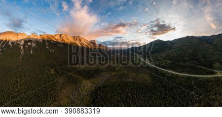 Picturesque Panoramic View Of Scenic Highway Surrounded By Golden Rocky Mountains At Sunset In Canad