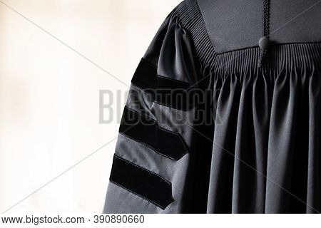 Phd Graduate In Black Gown University Degree