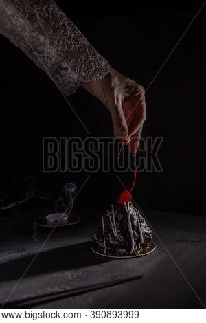 Hand Of Princess, Witch Or Evil Woman Poisoning Food With Own Blood From Wound Made With Needle. Rev