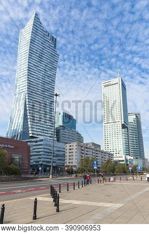 Warsaw, Poland - October 19, 2019: People Walk Street Of Emilia Plater Amongst The Modern Skyscraper