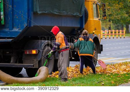 Moscow. Russia. October 11, 2020. Utility Workers Remove Yellow Autumn Leaves With An Industrial Vac