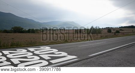 Greeting Card Decorated For New Year 2021 And Christmas. Landscape Scenery With 2021 On The Road. Wa