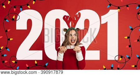 Emotional Santa Claus Deer Greeting With New Year 2021 And Christmas. Beautiful Woman In Red Costume