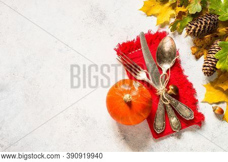 Autumn Table Setting With Silverware And Autumn Decorations At White Table. Top View With Copy Space