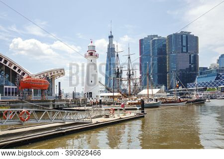 Sydney, New South Wales, Australia - February 11, 2020: Darling Harbor scenery with boats and city buildings.