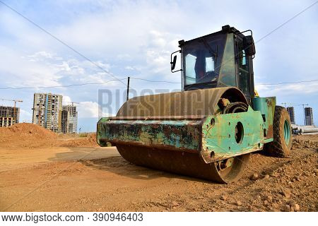 Vibro Roller Soil Compactor Leveling Ground At Construction Site. Vibration Single-cylinder Road Rol