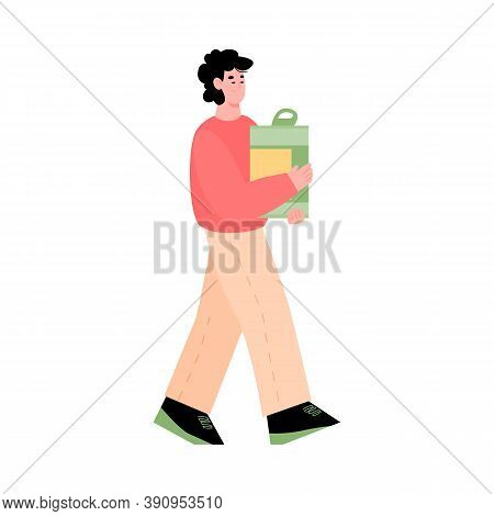 Young Man Volunteer Carry Cardboard Box Full Of Food For Donation In Social Shelter Or Charitable Ce