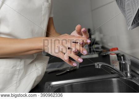 Women Hand Apply Talcum Powder. Doctor Puts Talcum Powder On His Hands Before Putting On Gloves
