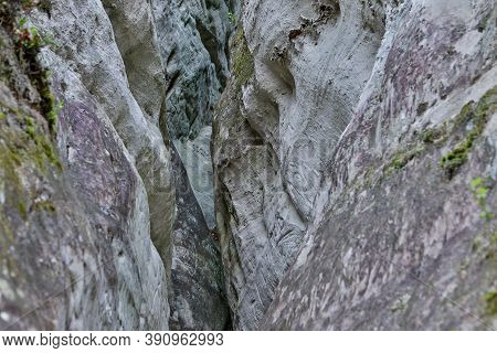 Details Of Old Rock Clifts Near Tourist Track. Photo Taken On A Cloudy Sprin Day In Latvia.