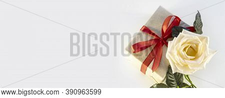 Handmade Gift Box With Red Ribbon And White Rose On White Background, Holiday Concept Valentines Day
