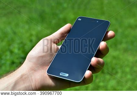 Chinese Smartphone Xiaomi Mi 5 In Male Hand