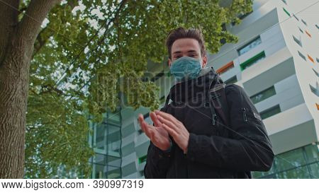 Portrait Of A Young Guy Wearing A Mask And Thank The Doctors For Their Efforts. The Teenager Stands 
