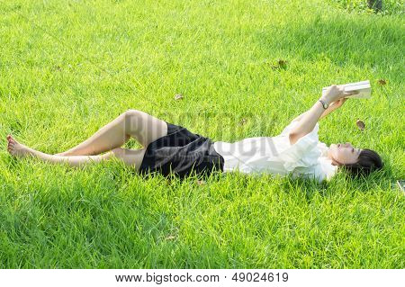 Woman Lying On The Grass