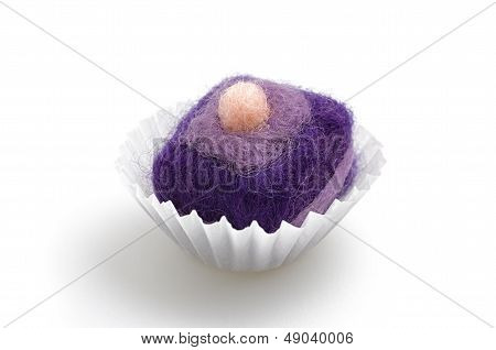 colorful felt praline on a white background