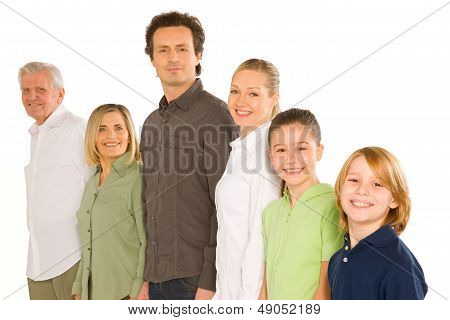 Three Generations Family Standing Isolated On White Background