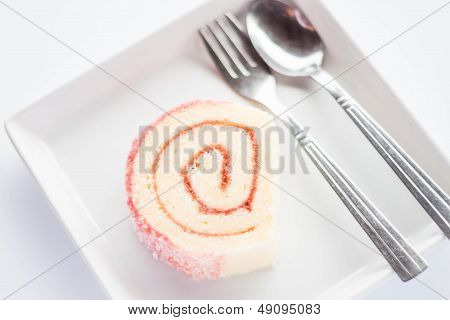 Strawberry Jam Roll Cake With Spoon And Fork