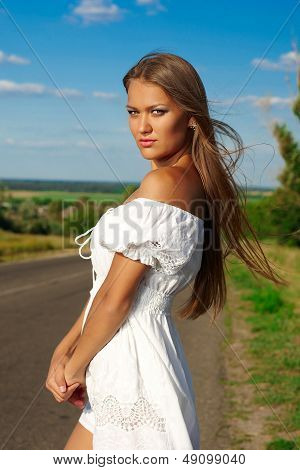 An Young Woman  A Cloudy Blue Sky