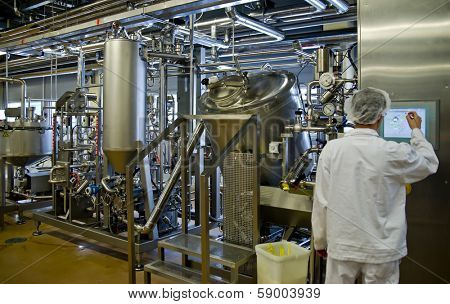 JUVASKULA, FINLAND - DECEMBER 18: Valio factory. Cheese production on February 14, 2013 in Jyvaskyla, Finland. Valio is one of biggest companies in Finland, produces dairy products