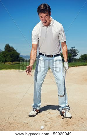 Golfer golf man having meltdown in bunker frustration