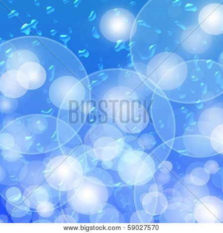 Blue Background. The Drops Of Water And Natural Bokeh