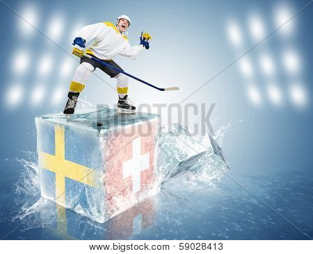 Sweden - Switzerland game. Spunky hockey player on ice cube