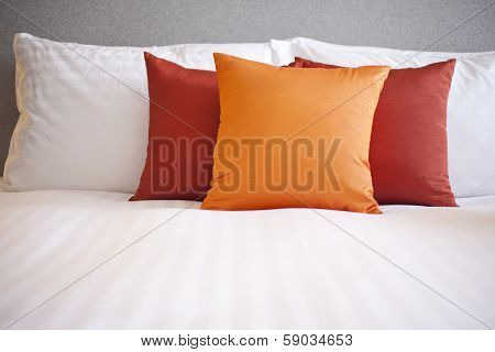 Colorful Pillow On Hotel Bed