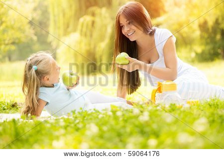 Mother and daughter in the nature