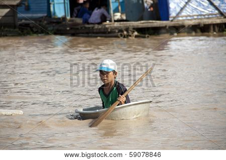 TONLE SAP LAKE, CAMBODIA - CIRCA APRIL 2012: Cambodian boy. Tonle Sap Lake.